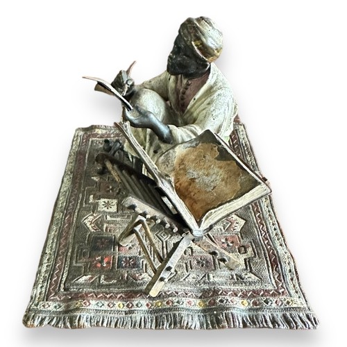 384 - Franz Bergman (Austrian, 1861-1936), late 19th century, cast as an Arab scribe seated on a carpet, t... 