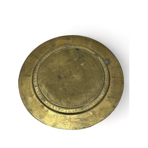 254 - A brass and copper Arts and Crafts style plate. Diameter 29.cm approx.