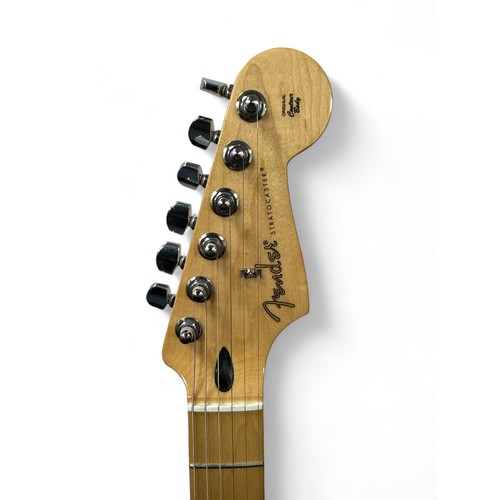 205 - Fender Player Stratocaster in a blue gloss finish. Still has protective film on the pickguard, which... 