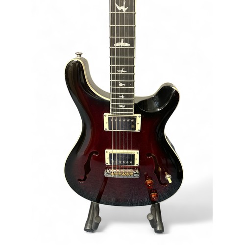 208 - Paul Reed Smith SE (Student Edition) Hollow body Electro Acoustic Guitar in a dark red finish. In ex... 