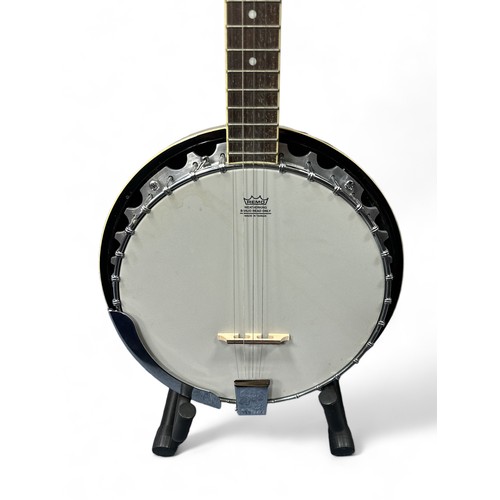 215 - Ozark Banjo in original hard-shell case. Missing the D string but in excellent condition. Buyer to c... 