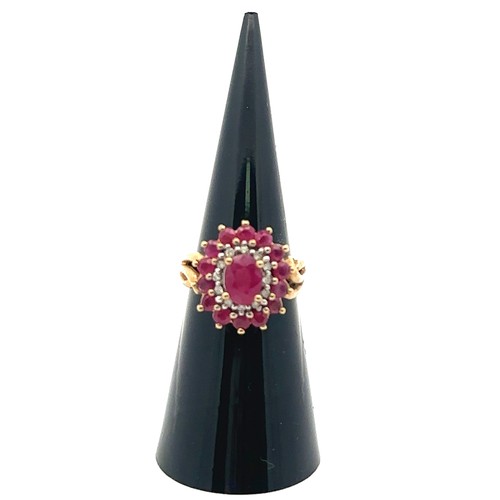 12 - A ruby and diamond 9ct gold cluster ring, size J. Weight 3.74g.

Please see the buyer's terms and co... 