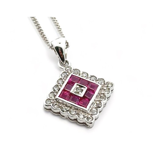 20 - A ruby and diamond 18ct white gold pendant necklace. Hallmarks to pendant and 18