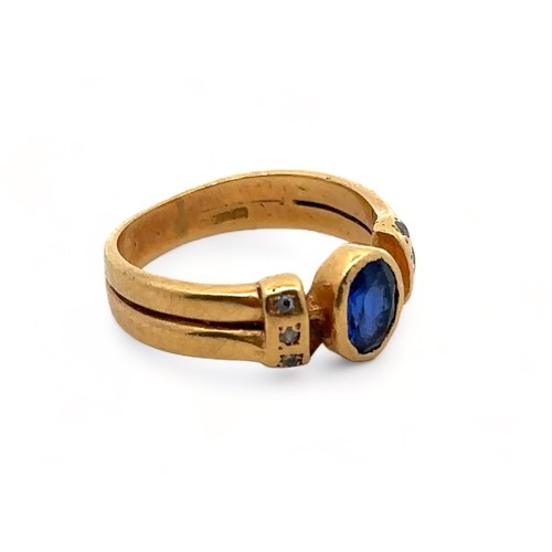 24 - A sapphire ring, with diamond set shoulders stamped 18ct/ 750, size J. Weight 3.98g.

Please see the... 