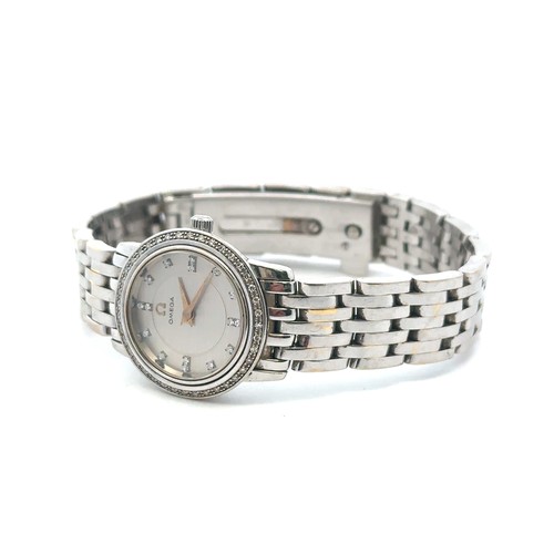 105 - Omega: A lady's 18ct white gold and diamond-set bracelet wristwatch. Case diameter approx 23mm, beze... 