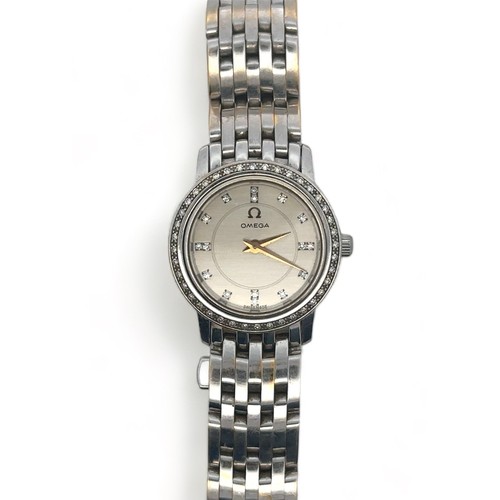 105 - Omega: A lady's 18ct white gold and diamond-set bracelet wristwatch. Case diameter approx 23mm, beze... 