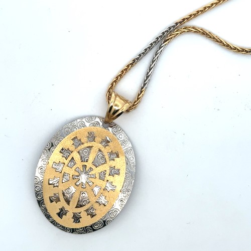 3 - A very attractive  yellow and white gold pendant suspended from a two tone 18