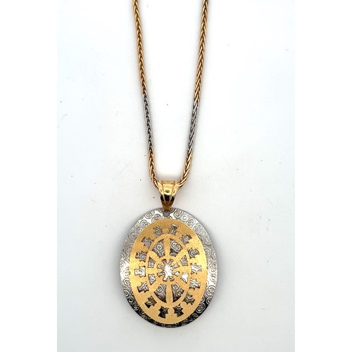 3 - A very attractive  yellow and white gold pendant suspended from a two tone 18