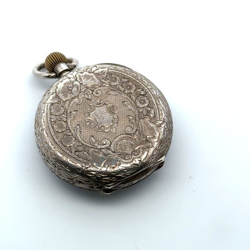 124 - A ladies 935 silver top wind pocket watch with decorated enamel dial.  Swiss three bears hallmarks. ... 