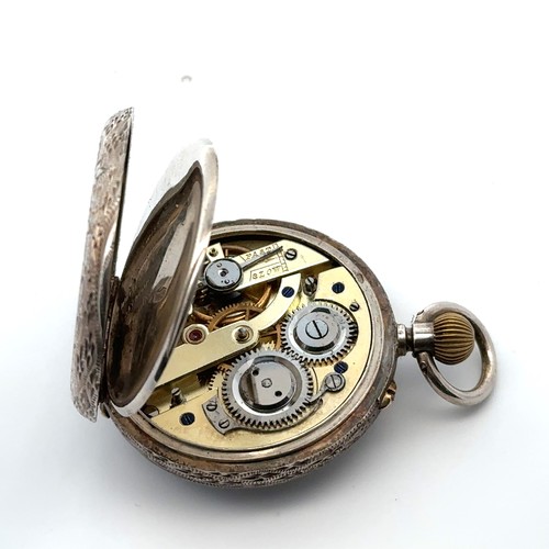 124 - A ladies 935 silver top wind pocket watch with decorated enamel dial.  Swiss three bears hallmarks. ... 