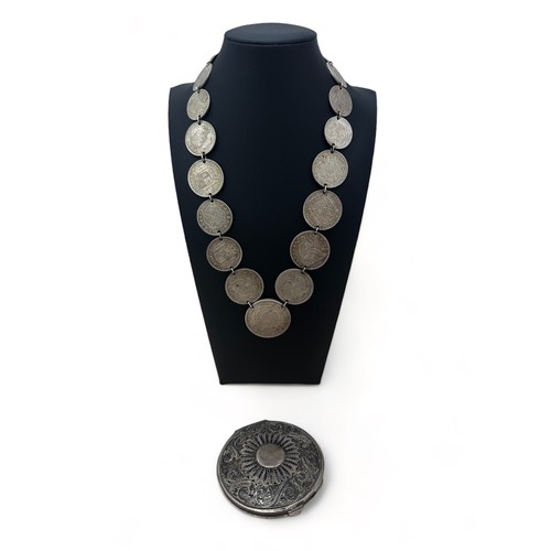 41 - A silver coin necklace made from 19th Century 800 and 900 silver coins such as US trade dollar, Kron... 