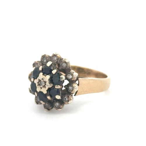 70 - A sapphire and diamond cluster ring, stamped 9ct. Size M. Weight 4.5g.

Please see the buyer's terms... 