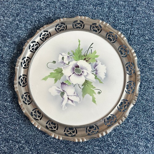 276 - Unusual porcelain plates with pewter rims, each with floral design, unmarked but almost certainly fr... 