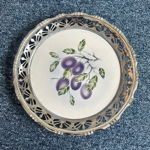 276 - Unusual porcelain plates with pewter rims, each with floral design, unmarked but almost certainly fr... 