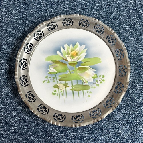 276 - Unusual porcelain plates with pewter rims, each with floral design, unmarked but almost certainly fr... 