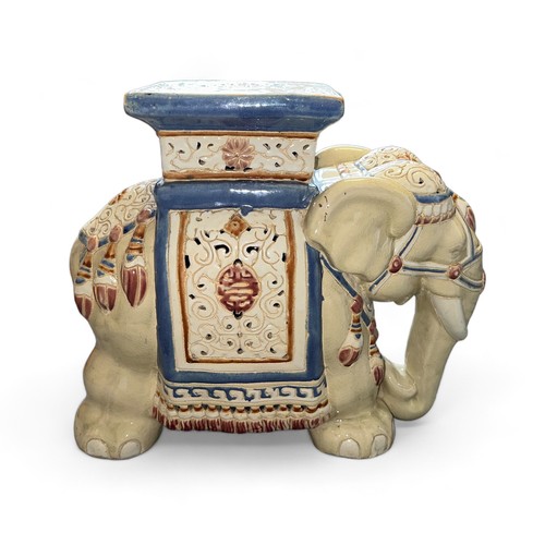 284 - A painted ceramic elephant design garden seat. Approx. 50 x 46 x 24cm.  There is a small crack to th... 