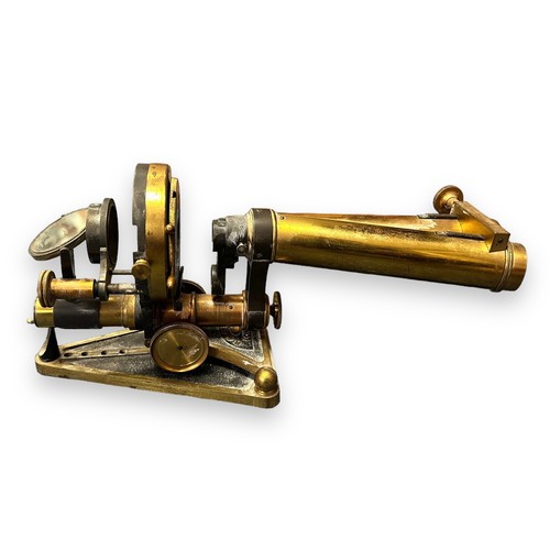 185 - R & J Beck of London, a 19th Century brass binocular microscope, standing upon a triangular-shaped f... 