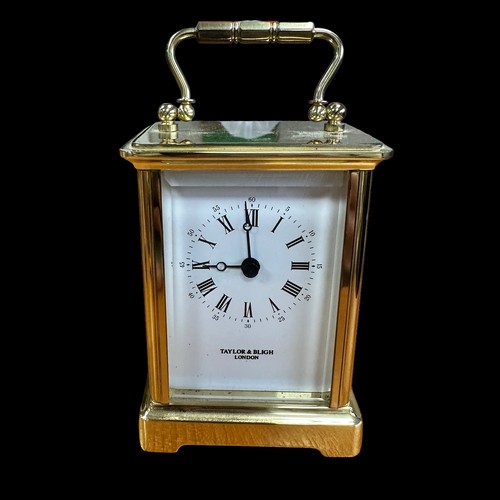 162 - Traylor & Bligh, pair of lacquered brass carriage clocks by Taylor & Bligh. Heights 15cm. (2)