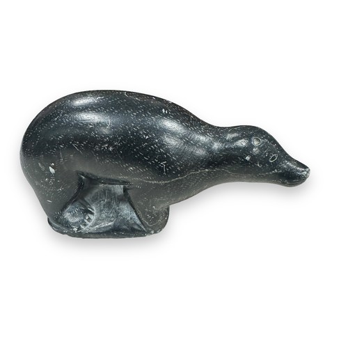 318 - Inuit soapstone carvings, to include; two seals one by Alice Mikiyuk (b.1926), and a polar bear by T... 