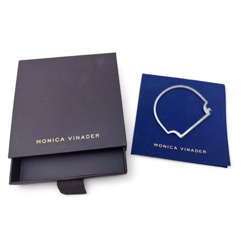 76 - A Monica Vinader 'Signature Skinny' silver bangle. With box and pouch.  Bracelet length 5.4cm, width... 