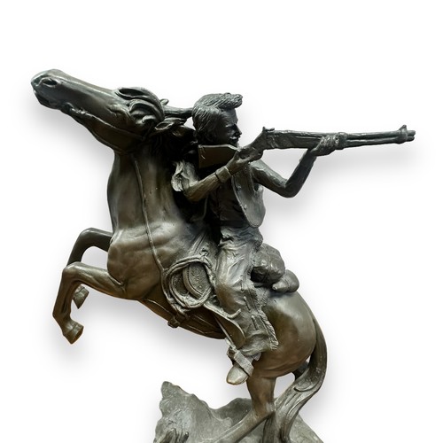 383 - Contemporary bronze effect sculpture of a Gunman on horseback, signed to mould Kamiko. Height 40cm.