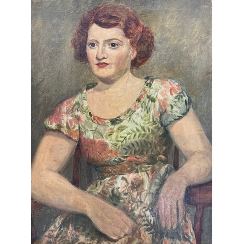 447 - 19th / 20th Century competent oil on canvas of a seated lady in floral dress. Indistinct pencil mark... 