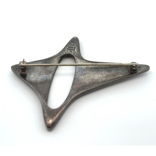 81 - A Danish silver Georg Jensen abstract star brooch, designed by Henning Koppel, pattern No. 339. Mark... 