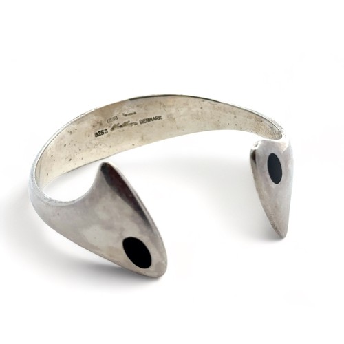 83 - A Hans Hansen Danish modernist silver and black enamel torque bangle, designed by Bent Gabrielsen, p... 