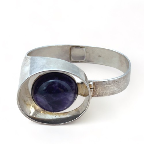 84 - A Kaunis Koru Finnish silver and amethyst cuff bracelet. Finland hallmarks for 1975.

Please see the... 