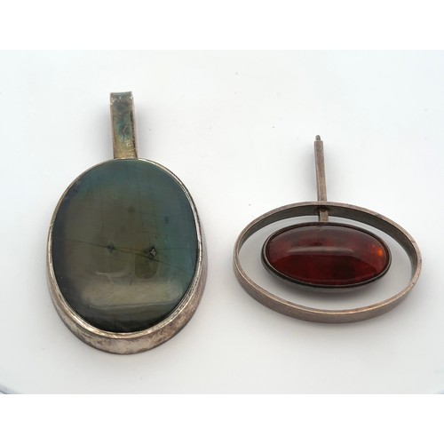 85 - Two Scandinavian silver and gem set pendants, a labradorite stone pendant with marks for the Finnish... 