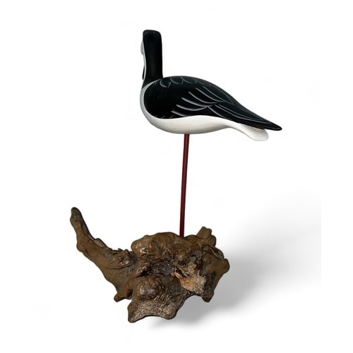 369 - Judith Nicoll (British, Contemporary), carved wooden sculpture of a shorebird, stood on driftwood ba... 