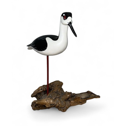 369 - Judith Nicoll (British, Contemporary), carved wooden sculpture of a shorebird, stood on driftwood ba... 