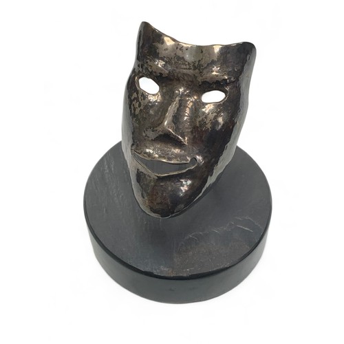 370 - Small unmarked white metal smiling mask metalwork sculpture stood on a round base. Height 9cm, diame... 