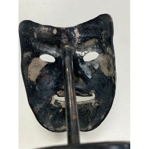 370 - Small unmarked white metal smiling mask metalwork sculpture stood on a round base. Height 9cm, diame... 