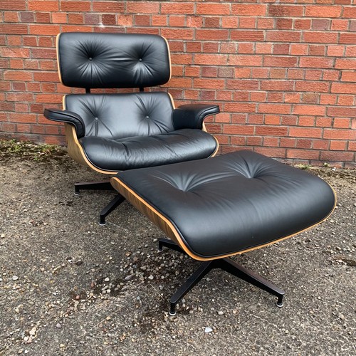 376 - After Charles and Ray Eames lounge chair and ottoman, black leather and moulded plywood with metal f... 