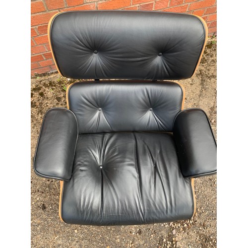 376 - After Charles and Ray Eames lounge chair and ottoman, black leather and moulded plywood with metal f... 