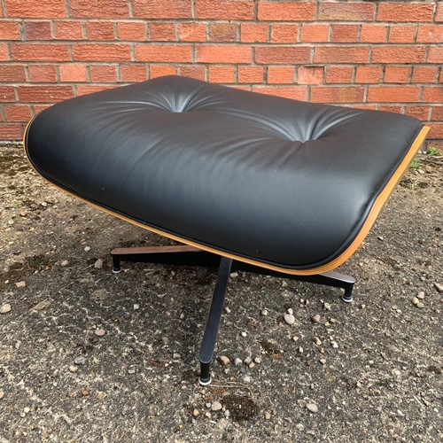 376 - After Charles and Ray Eames lounge chair and ottoman, black leather and moulded plywood with metal f... 