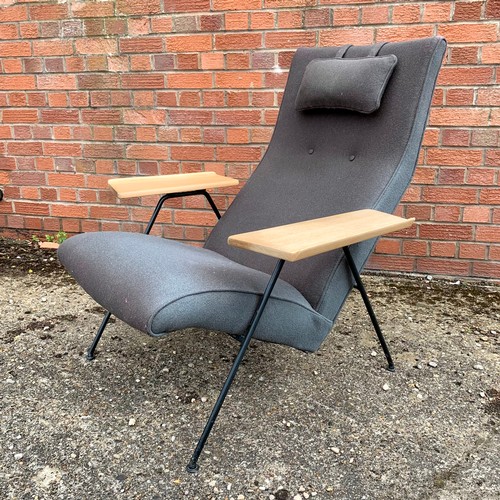 375 - Robin Day (British, 1915-2010), Recliner Chair, broad oak table style arm rests on iron frame, desig... 