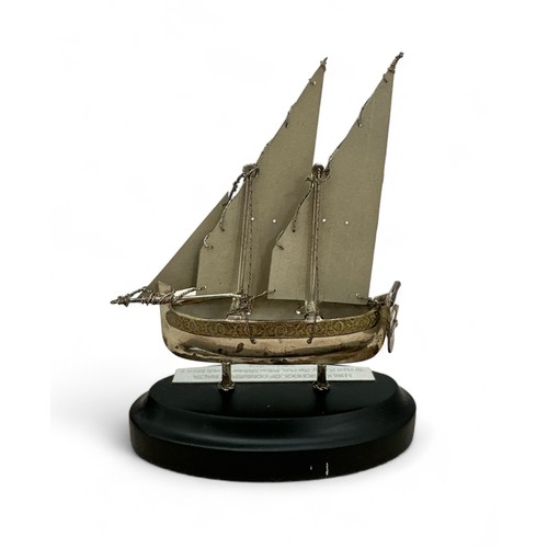 156 - The Maltese Silver Collection, 925 silver model ship on stand. Inscription for London School of Comm... 