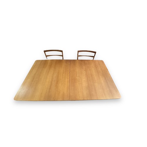 474 - A McIntosh mid-Century teak extending dining table with 6 chairs (2 bring carvers). Width 91cm, heig... 