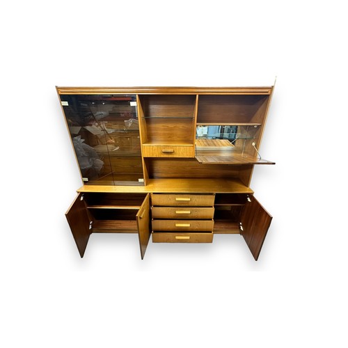 475 - A large mid-Century display unit, 4 central drawers and 3 cupboards to base, double glazed display c... 