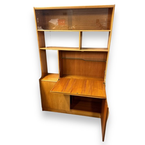 479 - A mid Century display cabinet with drinks cabinet over a double cupboard and top section with 2 glaz... 