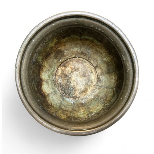 302 - A Japanese bronze jardiniere / planter with bird design. Diameter of top 21cm.