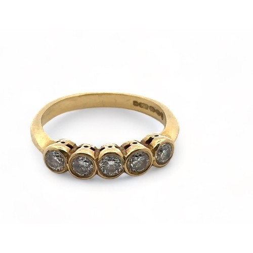 4A - An 18ct gold collet set five stone diamond ring, size  J. Weight 2.8g.

Please see the buyer's terms... 