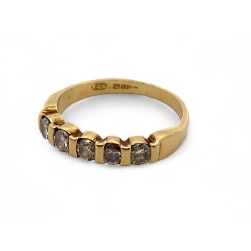 10A - An 18ct gold five stone diamond ring, size K. Weight 2.9g

Please see the buyer's terms and conditio... 