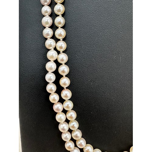 71 - A cased double cultured pearl necklaces with clasp stamped 375. Can be detached to form two single s... 