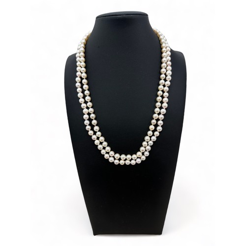 71 - A cased double cultured pearl necklaces with clasp stamped 375. Can be detached to form two single s... 