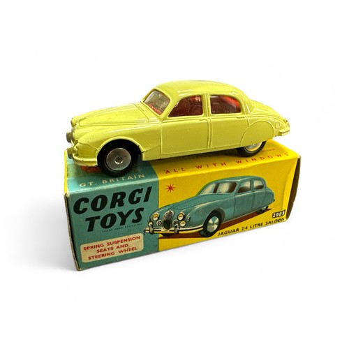 61 - Corgi Jaguar 2.4 Litre No. 208S, primrose with red interior, flat spun hubs and folded leaflet, gene... 