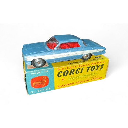 91 - Corgi Oldsmobile Super 88 No. 235, generally excellent in good plus box, metallic blue with red inte... 