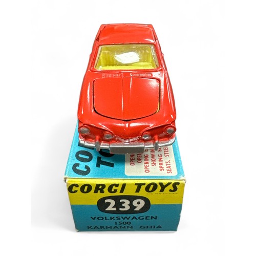 94 - Corgi No. 239 Volkswagen 1500 Karmann Ghia, red with yellow interior, spare wheel, small suitcase an... 